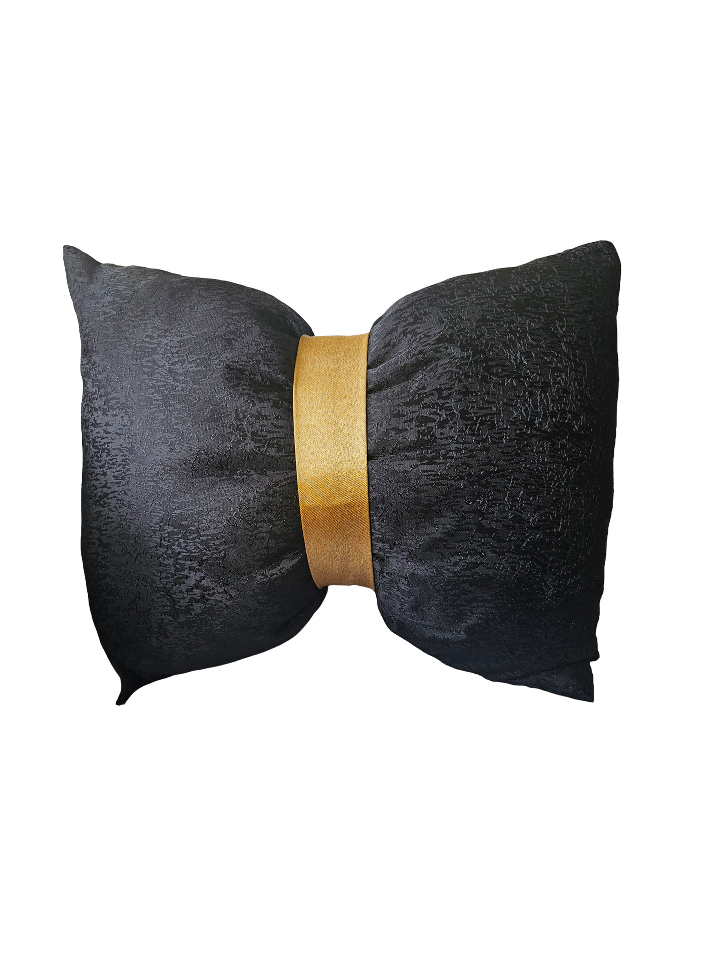 Black textured bow-shaped pillow with gold accent on a white background